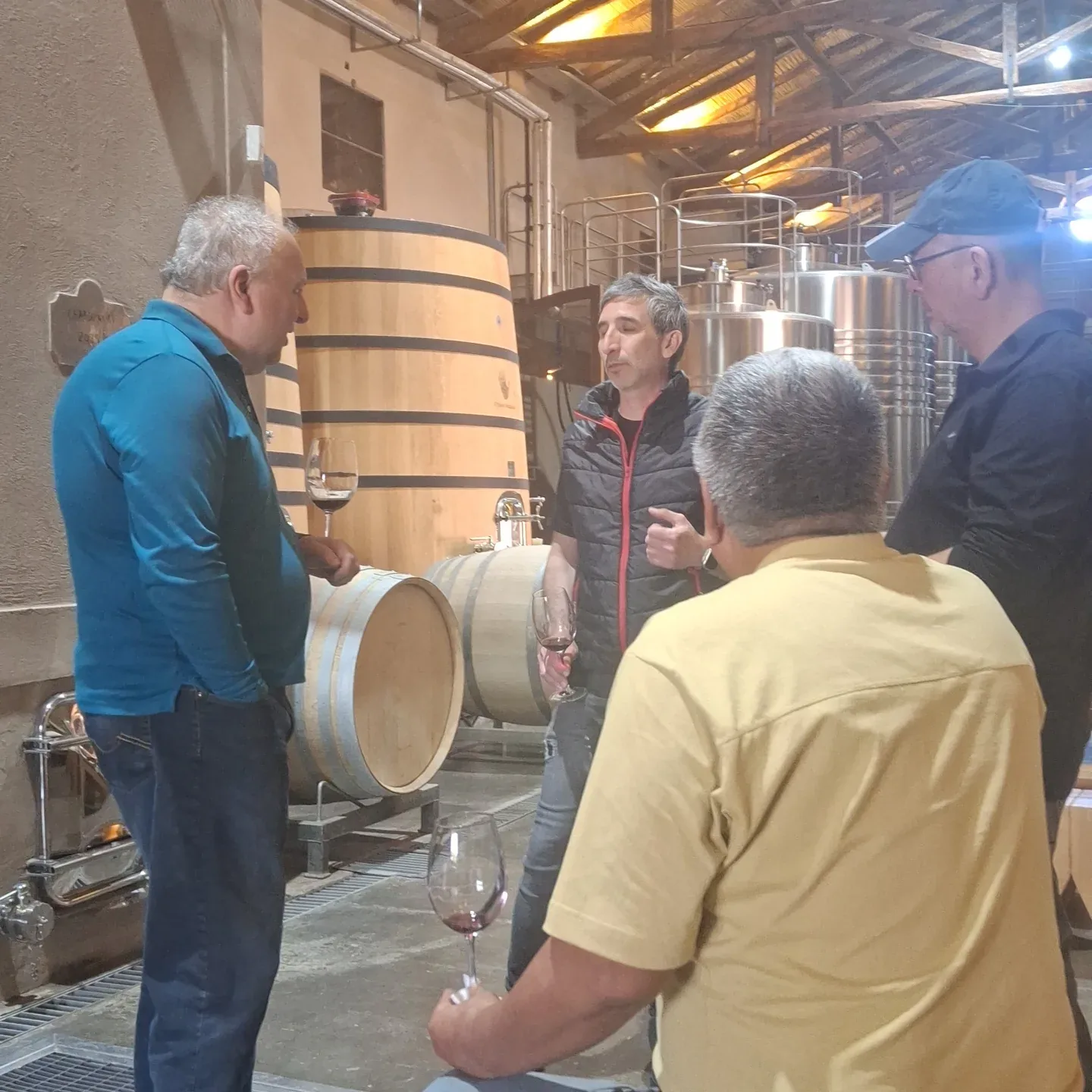 Matías with guests tasting wine in a Mendoza cellar